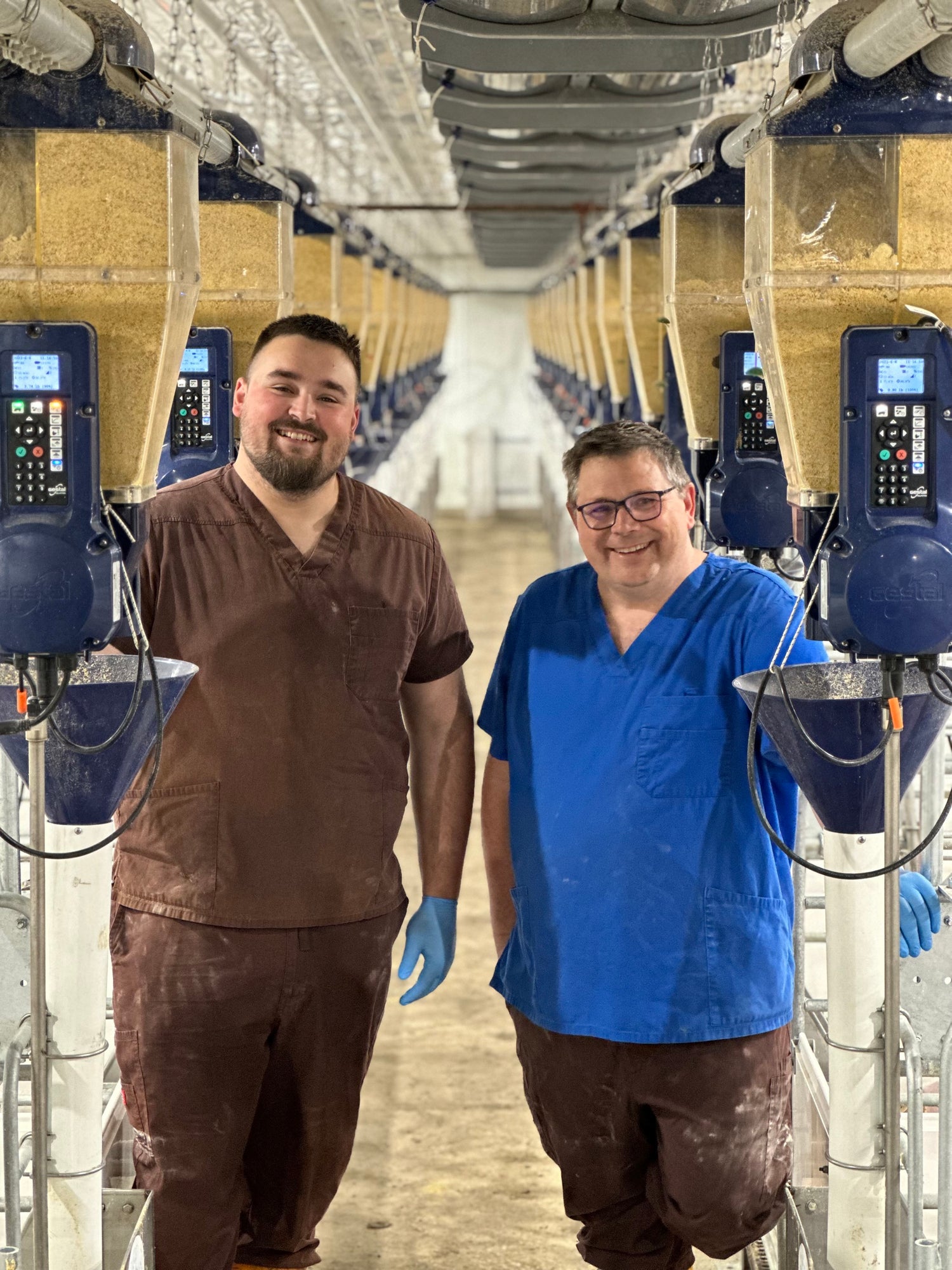 Samuel and Alain Lefebvre and a row of GESTAL feeding system
